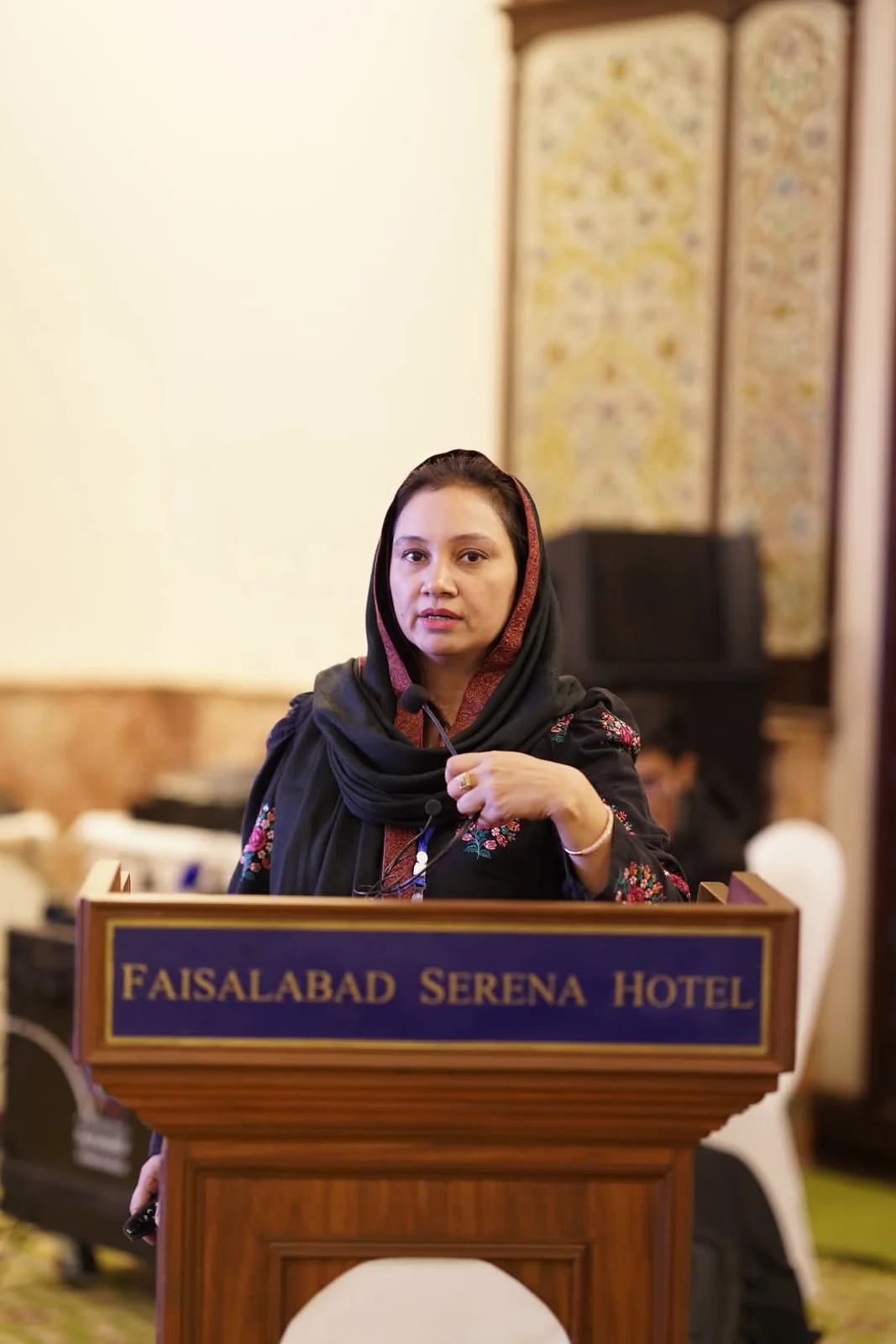 Dr Nadia Ali speaking at dermatology conference